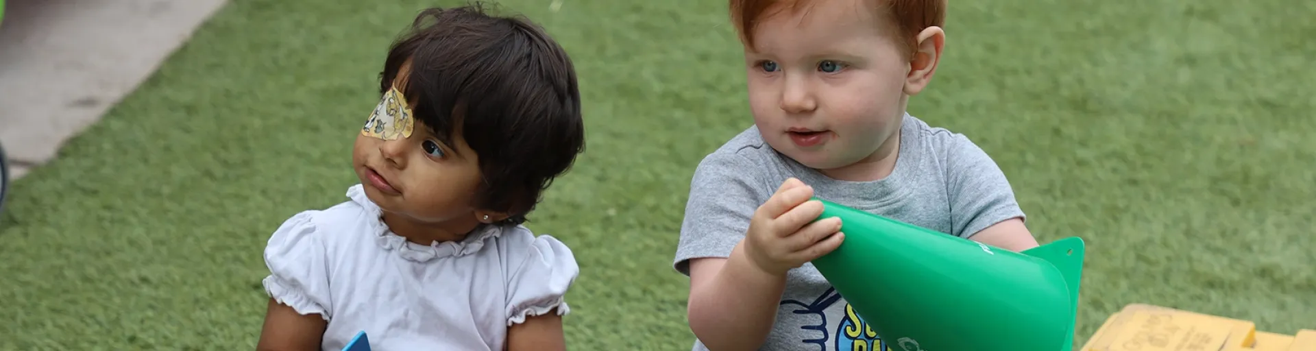 Holding colorful cones outdoors